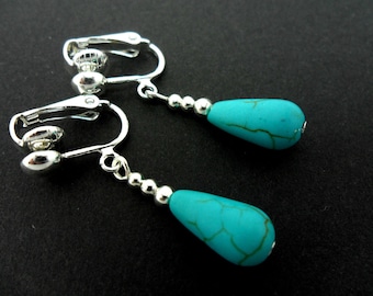 A pair of hand made tibetan silver & turquoise bead dangly teardrop clip on earrings. new.