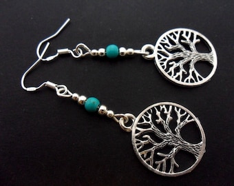 A pair of hand made tibetan silver tree of life dangly earrings with 925 solid silver hooks and turquoise beads.