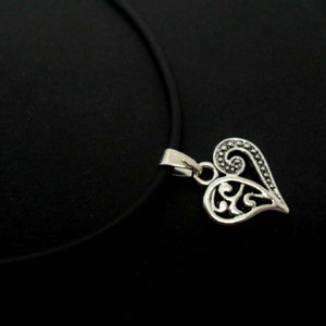 A rubber cord 13" - 14" tibetan silver heart charm choker necklace.