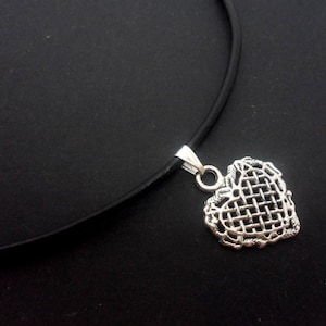 A leather cord 13&quot; - 14&quot; tibetan silver heart charm choker necklace.