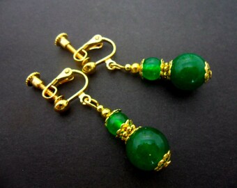 A pair of pretty gold plated green jade  bead  dangly clip on earrings.