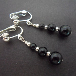 A pair of pretty hand made black onyx bead  dangly clip on earrings.