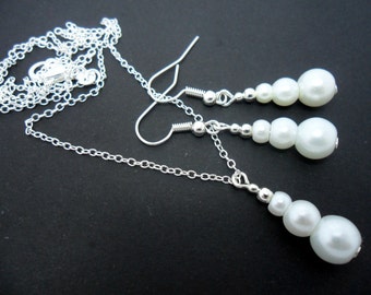 A hand made white glass pearl  necklace and earring set.