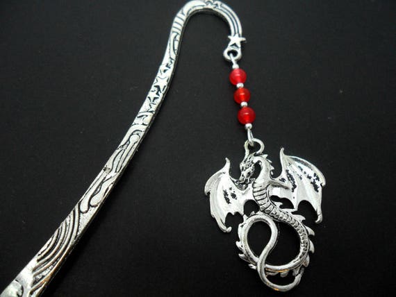 A pair of hand made tibetan silver cute little flower themed red jade bead dangly clip on earrings.