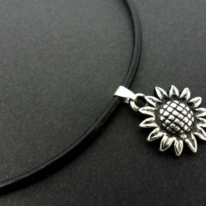 A leather cord 13&quot; - 14&quot; tibetan silver sunflower charm choker necklace.