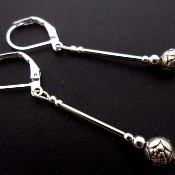A pair of cute little hand made tibetan silver dangly leverback hook earrings. new.