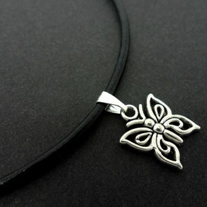 A leather cord 13" - 14" tibetan silver butterfly charm choker necklace.