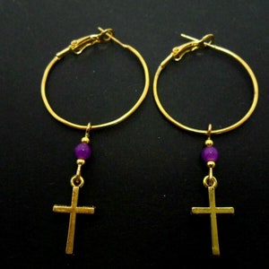 A pair of gold colour 30mm 1&quot; hoop cross and purple jade bead earrings.