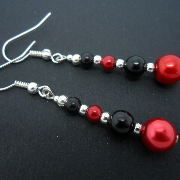 A pair of pretty  red and black glass pearl  bead  dangly earrings.