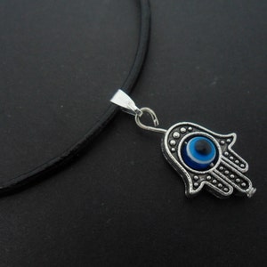 A leather cord 13&quot; - 14&quot; tibetan silver hamsa hand/eye charm choker necklace.