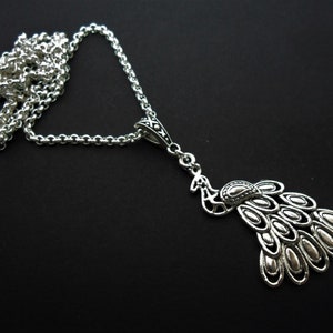 A black peacock themed pendant necklace on an 18&quot; chain. New.