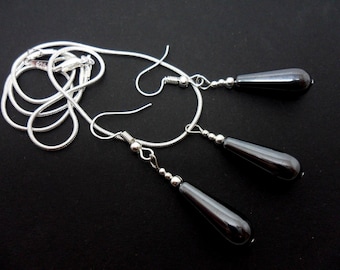 A hand made hematite  teardrop necklace and dangly earring set.