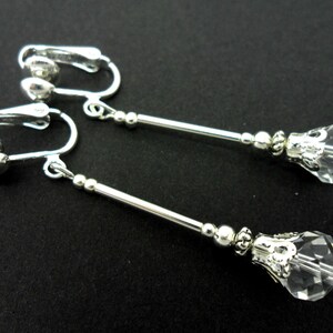 A pair of pretty clear crystal  dangly clip on earrings.