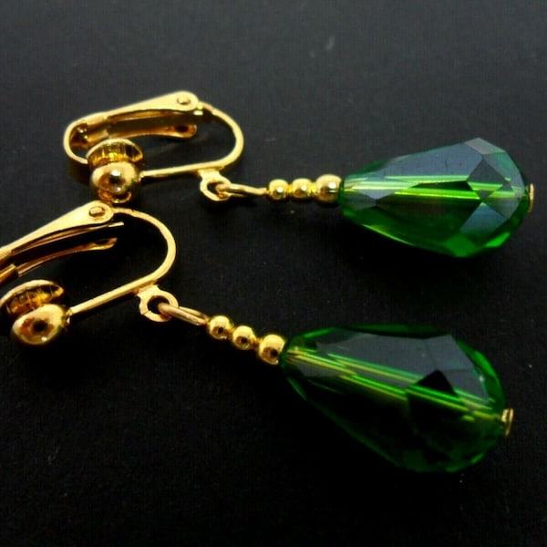 A pair of pretty gold plated green crystal teardrop bead  dangly clip on earrings.