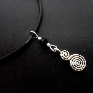 A leather cord 13" - 14" tibetan silver swirl charm choker necklace.