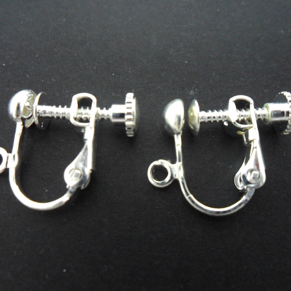 Un par de clips para orejas no perforados con palanca/tornillo. color plata . nuevo.