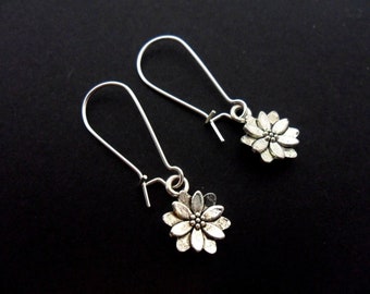 A pair of tibetan silver flower earrings on kidney wire hooks. New.