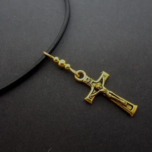 A leather cord 13&quot; - 14&quot; gold colour cross charm choker necklace.