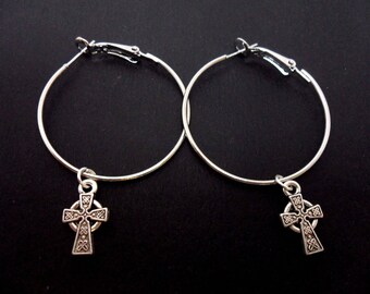 A pair of silver plated 35mm 1.5" hoop and celtic cross charm earrings.