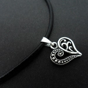 A leather cord 13" - 14" tibetan silver heart charm choker necklace.