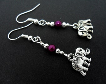 A pair of cute tibetan silver elephant  & purple pearl bead dangly earrings.