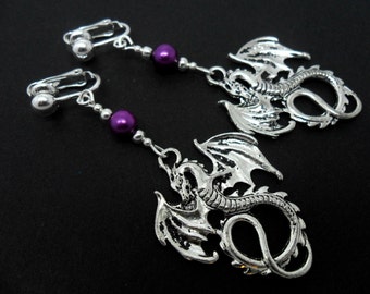 A pair of pretty tibetan silver & purple bead dragon themed dangly clip on  earrings.