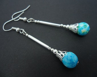 A pair of pretty hand made blue ocean jade bead dangly earrings.