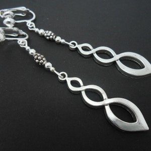 A pair of pretty tibetan silver long dangly clip on  earrings.