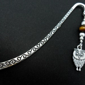 A tibetan silver owl and tigers eye bead bookmark. 9cm long.