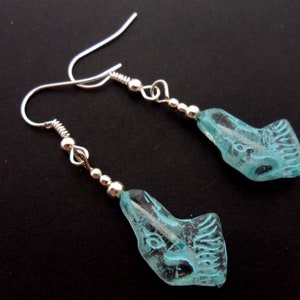 A pair of pretty dog themed authentic czech glass dangly earrings.