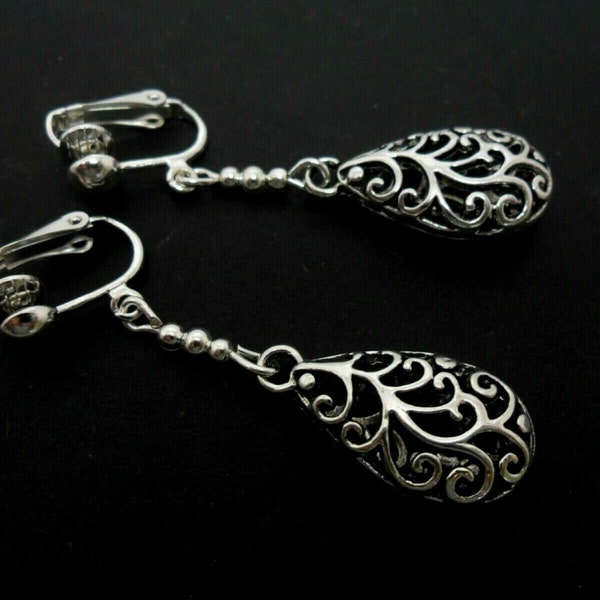 A pair of pretty tibetan silver filigree teardrop dangly clip on earrings.