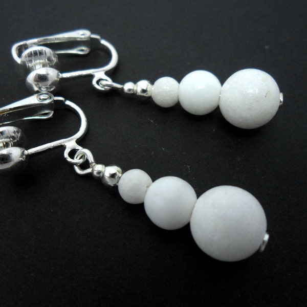 A pair of pretty white jade  bead  dangly clip on earrings.