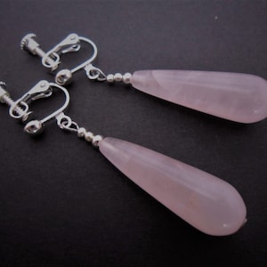 A pair of pretty pink jade bead long dangly teardrop screw back clip on earrings.