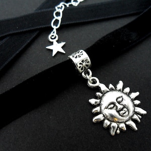 A ladies/girls black velvet 10mm (half inch) choker sun charm necklace.