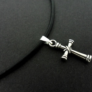 A leather cord 13" - 14" tibetan silver cross charm choker necklace.