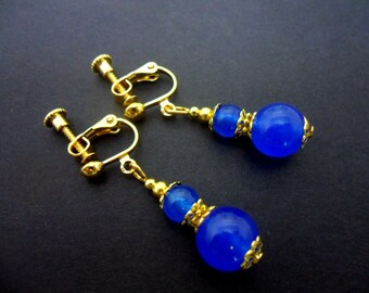 A pair of pretty blue jade  bead  gold plated dangly clip on earrings.