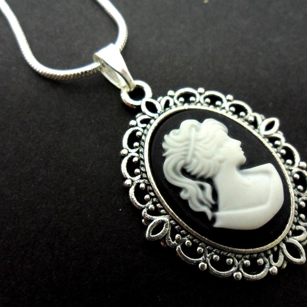 A lovely tibetan silver cameo  pendant necklace on an 18" snake chain.