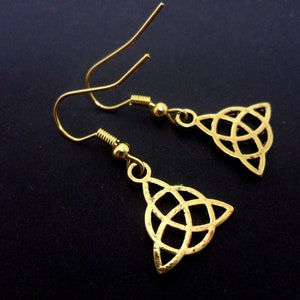 A pair of gold colour celtic knot dangly earrings. new.