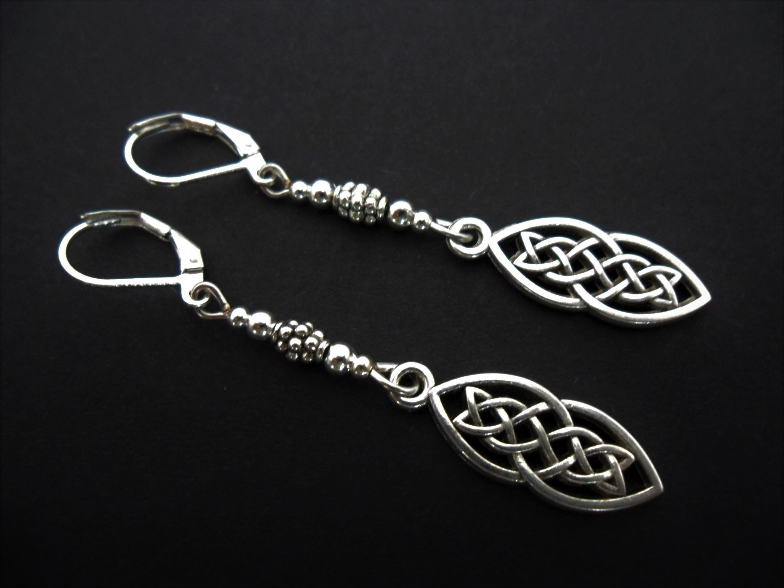 A pair of tibetan silver celtic knot themed long dangly leverback hook earrings. new.