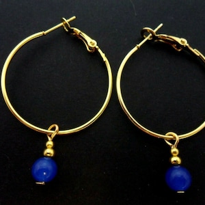 A pair of gold colour 30mm 1&quot; hoop and blue  jade bead earrings.