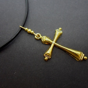 A leather cord 13&quot; - 14&quot; gold colour cross charm choker necklace.
