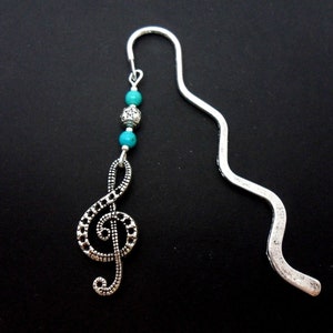 A tibetan silver treble clef musical note and turquoise bead bookmark. 9cm long.