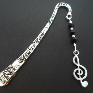 A tibetan silver and treble clef musical note   charm  bookmark.