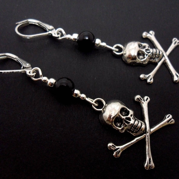 A pair of tibetan silver skull and crossbones dangly leverback hook earrings.