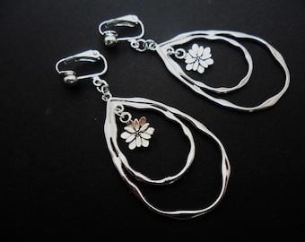 A pair of pretty tibetan silver flower teardrop dangly clip on earrings.