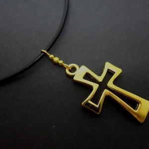 A leather cord 13&quot; - 14&quot; gold colour cross charm choker necklace.