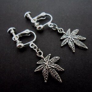 A pair of cute little tibetan silver cannabis leaf dangly screw back clip on earrings.