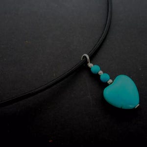 A leather cord 13" - 14" turquoise  heart charm choker necklace.