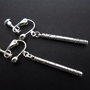 A pair of hand made tibetan silver slim long dangly screw back clip on earrings.