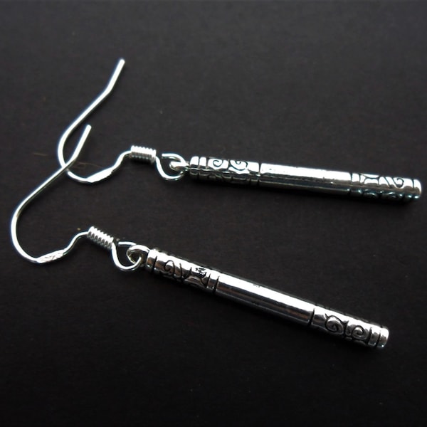 A pair of hand made slim tibetan silver dangly earrings with 925 solid silver hooks.